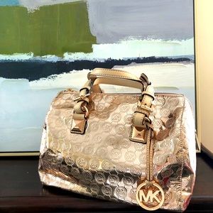 Michael Kors Rose Gold metallic handbag.